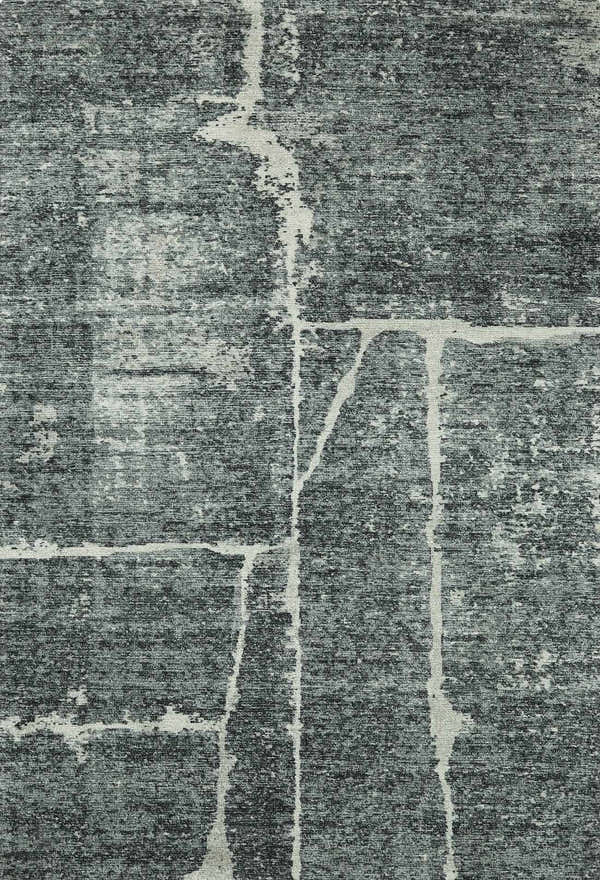 Close-up of the Janek II Modern Abstract Area Rug. Hand-tufted polyester rug in shades of gray with a white abstract pattern. Design-Rectangle