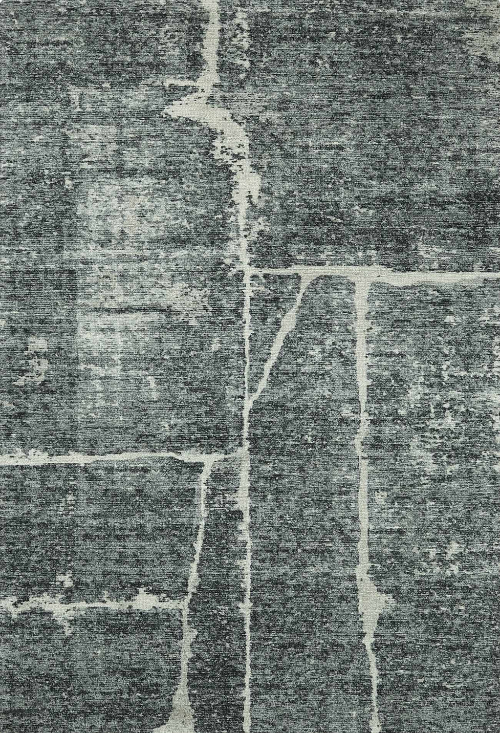 Close-up of the Janek II Modern Abstract Area Rug. Hand-tufted polyester rug in shades of gray with a white abstract pattern. Design-Rectangle