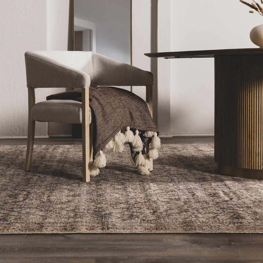 Neutral dining room with a beige chair and the beige and brown Collins Avenue III Vintage Damask Area Rug. Roomscene-Rectangle