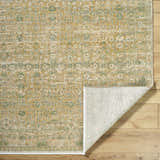 Close-up of Becki Olive Owens x Livabliss Renaissance Area Rug. Beige, olive, and tan floral pattern on a hand-crafted wool rug. Fold