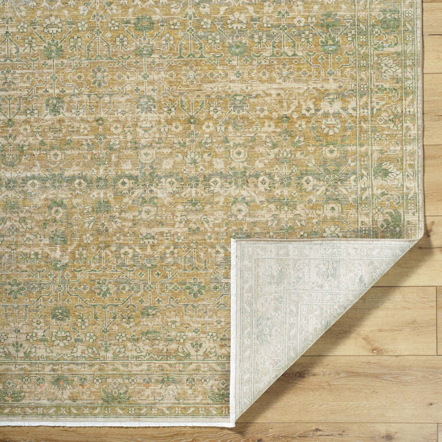 Close-up of Becki Olive Owens x Livabliss Renaissance Area Rug. Beige, olive, and tan floral pattern on a hand-crafted wool rug. Fold