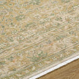 Close-up of the beige, olive, and tan Becki Owens x Livabliss Renaissance Area Rug showing its handcrafted wool texture. Texture