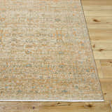 Close-up of the Becki Denim Owens x Livabliss Renaissance Area Rug; beige, denim, coral, and tan traditional pattern. Front