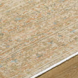 Close-up of the hand-crafted Becki Denim Owens x Livabliss Renaissance Area Rug. Beige, denim, coral, and tan wool rug. Texture