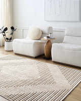 Living room scene with Briana Brown Washable Area Rug, beige chairs, wood table, and neutral decor. Contemporary style. Roomscene-Rectangle