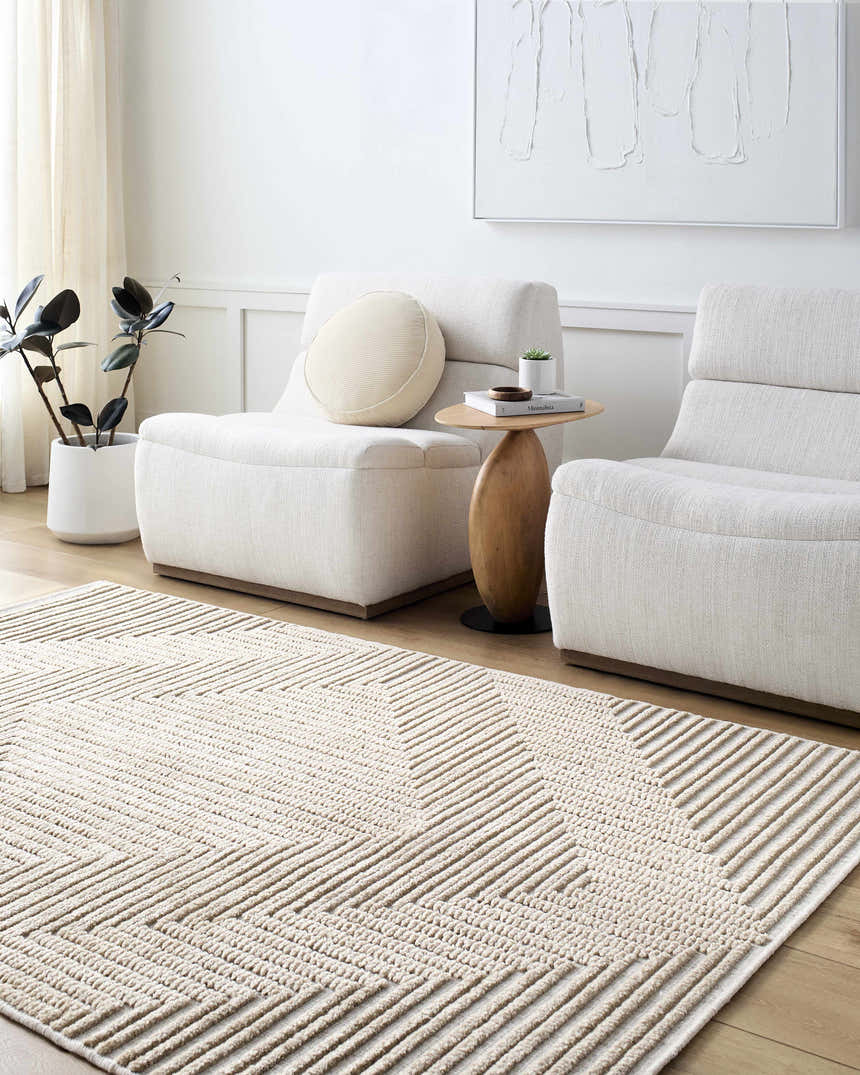Living room scene with Briana Brown Washable Area Rug, beige chairs, wood table, and neutral decor. Contemporary style. Roomscene-Rectangle