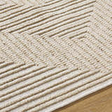 Close-up of the beige Briana Brown Washable Area Rug. Contemporary style with a geometric pattern and textured weave. Texture