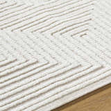 Close-up of Briana Beige Washable Area Rug showing geometric pattern and soft, textured pile. Contemporary style. Texture