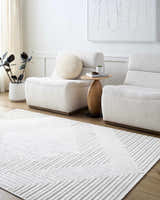 Minimalist living room with two chairs and Briana Off-White Washable Area Rug with geometric pattern. Roomscene-Rectangle