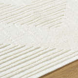 Close up of the Briana Off-White Washable Area Rug. Cream rug with a geometric, raised line pattern and soft, textured pile. Texture