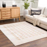 Living room scene with a Baback Beige Washable Area Rug, sofa, and wooden cabinet for a contemporary style. Roomscene-Rectangle