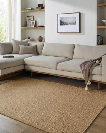 Living room scene with a Breena 3D Solid Brown Washable Area Rug, beige sectional sofa, and light wood accents. Roomscene-Rectangle