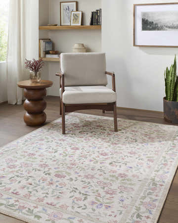 Living room scene with a Brigid Washable Area Rug, floral pattern in light blue, green, pink, and off-white colors. Roomscene-Rectangle
