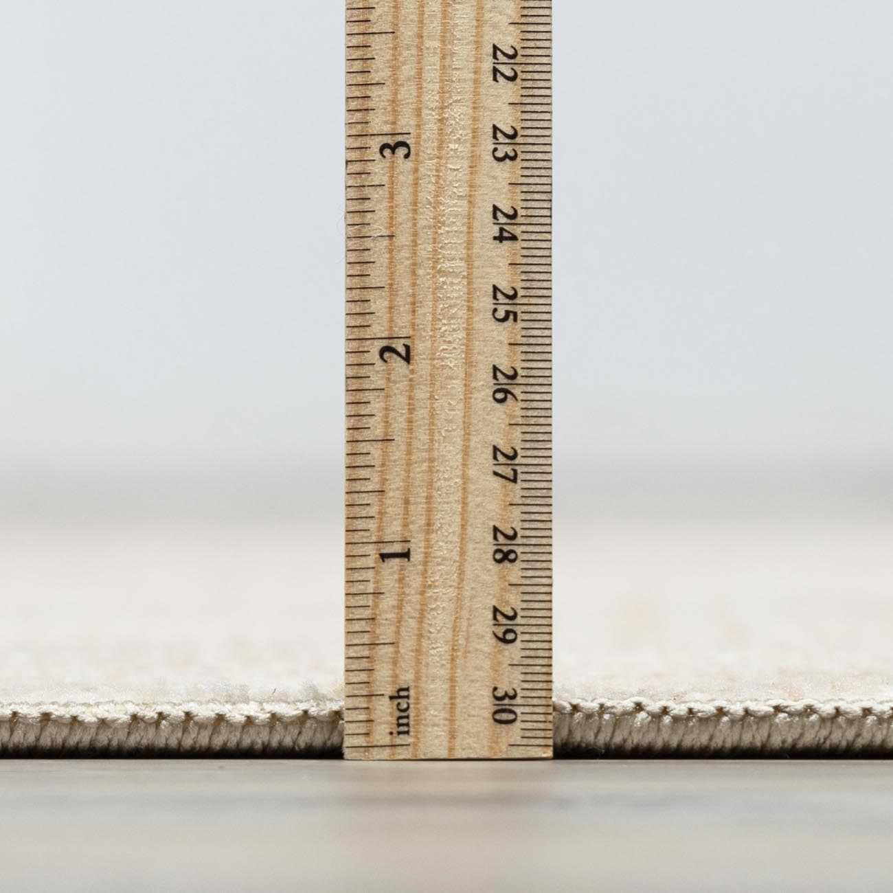 Close-up of the Galey Alix Collins Avenue rug pile height, showing beige, ivory, and light gray tones with a vintage medallion pattern. Pile