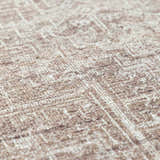 Close-up of the Galey Alix Collins Avenue VI Vintage Medallion Rug. Dark brown and ivory farmhouse style rug texture. Texture