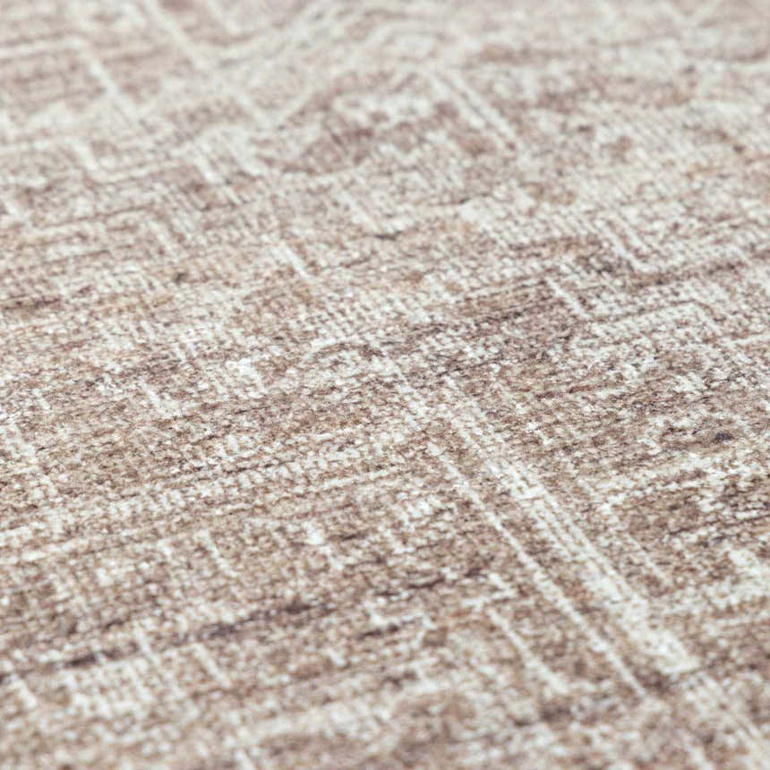 Close-up of the Galey Alix Collins Avenue VI Vintage Medallion Rug. Dark brown and ivory farmhouse style rug texture. Texture