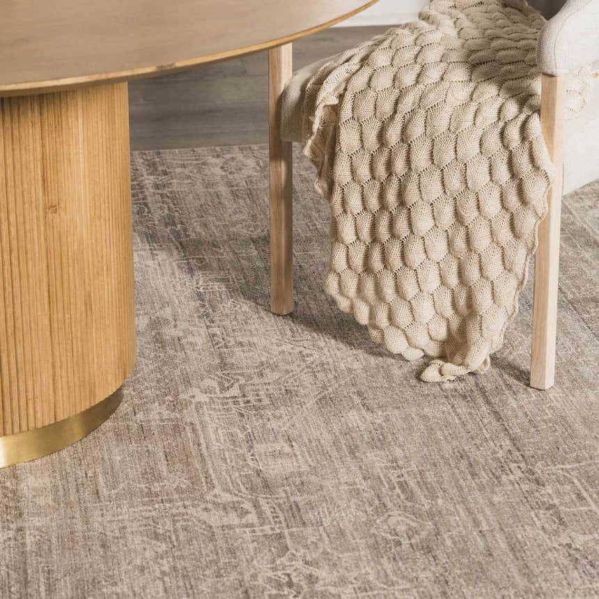 Close-up of the Galey Alix Collins Avenue VIII Vintage Medallion Rug in a neutral color palette with a traditional pattern. Styleshot