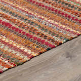 Close-up of the hand woven Brenda Crimson Area Rug. Farmhouse style rug with red, orange, and green tones. Pile