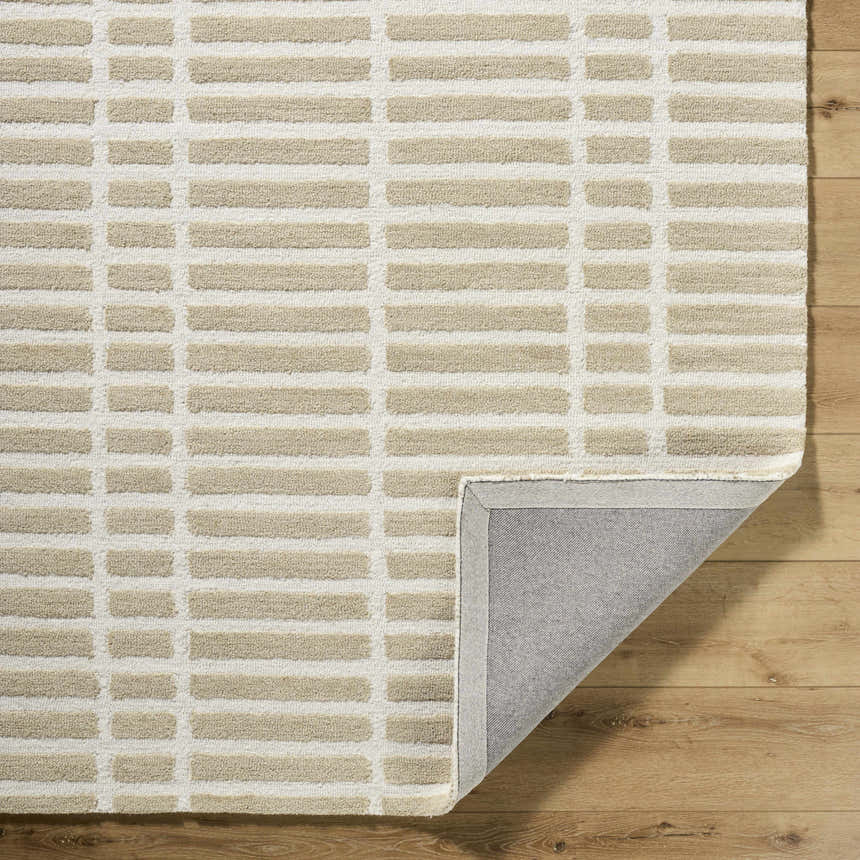 Close-up of Bendek Beige Area Rug. Hand-tufted wool rug with a contemporary beige and ivory geometric pattern. Fold