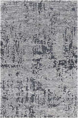 Close-up of Bomaderry Area Carpet. Contemporary design in charcoal, light gray, and medium gray. Hand woven polyester rug. Design-Rectangle-576
