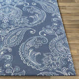 Close-up of the Simpatico Candice Olson x LIVABLISS SPO-1000 Area Rug. Features a blue paisley pattern on a wool rug. Front