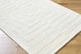 Close-up of the cream Armina Area Rug featuring a contemporary geometric pattern and hand-loomed wool texture. Corner