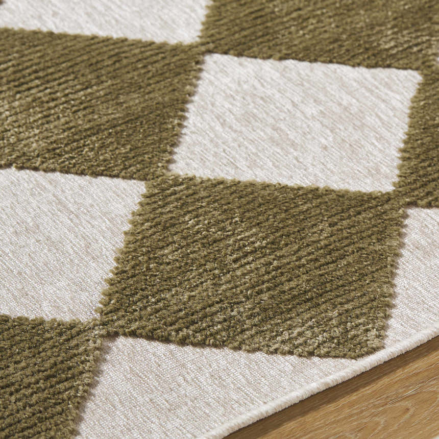 Close up of Bosley Olive Washable Area Rug showing the off white and olive checkerboard pattern and soft texture. Texture
