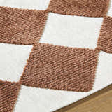 Close-up of the Bosley Brown Washable Area Rug, featuring a textured, brown and off white checkerboard pattern. Texture
