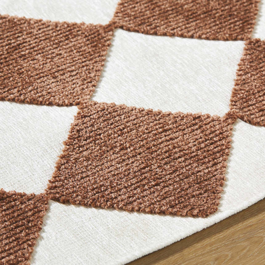Close-up of the Bosley Brown Washable Area Rug, featuring a textured, brown and off white checkerboard pattern. Texture