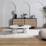 Living room scene with Burdette Soft Neutral Rug, marble coffee table, and cane cabinet against arched wall. Roomscene-Rectangle