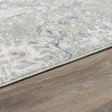 Close-up of Barkisland Thick Luxe Oushak Rug showing its floral pattern and colors of light beige, sage and gray. Corner