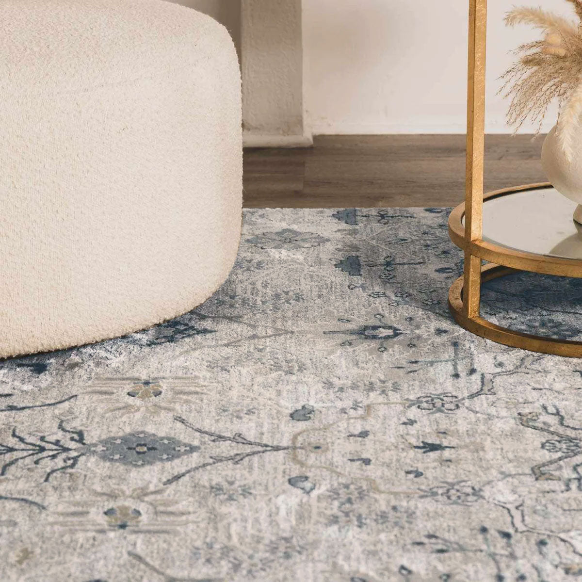 Close-up of the Barkisland Thick Luxe Oushak Rug in light beige, teal, and gray with a floral pattern and a textured weave. Styleshot