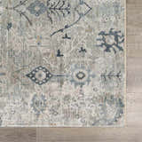 Close-up of the Barkisland Thick Luxe Oushak Rug. Features deep teal, sage, and beige floral and geometric patterns. Swatch