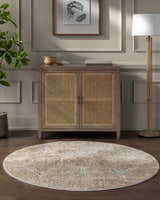 Living room scene with a round Barneyside Luxe Area Rug in cream and light brown, styled with a cabinet and floor lamp. Roomscene-Round