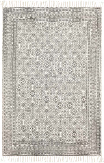 Close-up of the Brushton Area Rug. Hand-woven cotton rug in beige and black with a diamond and floral pattern and fringed edges. Design-Rectangle-576