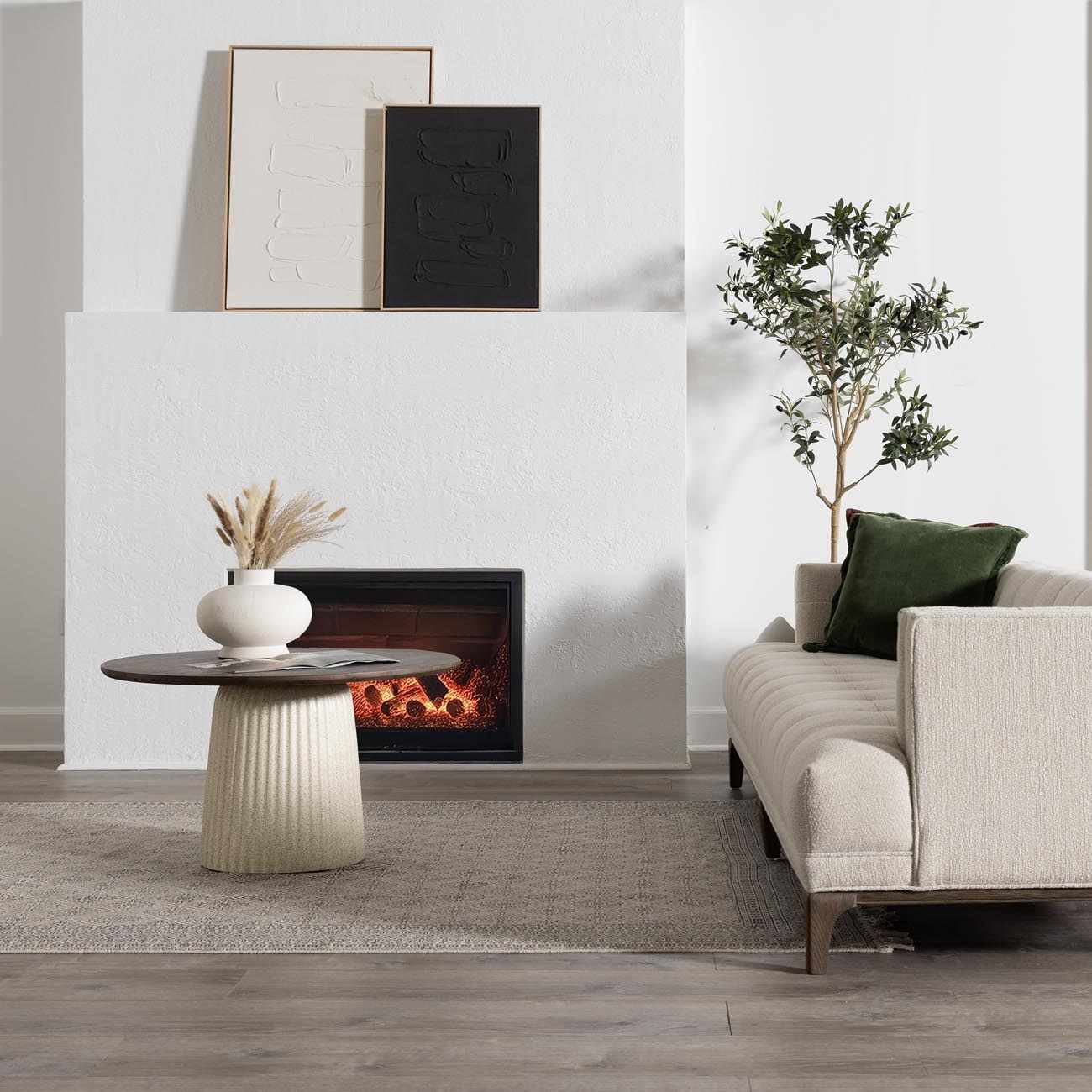 Living room scene with beige Brushton Area Rug, fireplace, modern art, and neutral sofa. Roomscene-Rectangle