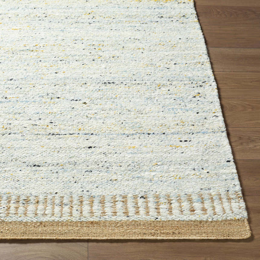Close-up of the hand woven Andrey Dark Beige Area Rug, showing charcoal, light brown, and medium brown tones and textured wool. Front