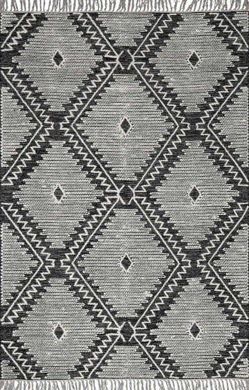 Close-up of the Brownhills rug. Hand woven cotton and wool rug with black and cream geometric diamond pattern. Design-Rectangle