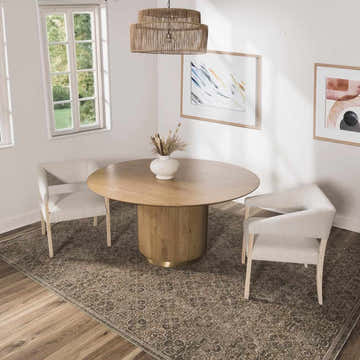 Dining room with a round wood table and Galey Alix x Livabliss Vintage Oriental Boho Olive Myrtle Avenue II Area Rug. Roomscene-Rectangle