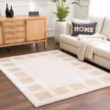 Living room scene with a beige sofa and the Beynon Beige Washable Area Rug featuring a square pattern. Roomscene-Rectangle