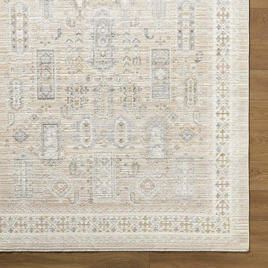 Close-up of the Fugia Beige Persian rug showing the traditional pattern, neutral colors, and machine woven texture. Corner