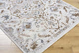 Close-up of the Aldona Area Rug showing its traditional floral pattern in charcoal, ivory, slate gray, and taupe. Corner