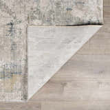 Close-up of the Burstwick Thick Luxe Boutique Rug showing its dusty sage, navy, and taupe abstract design and woven texture. Fold