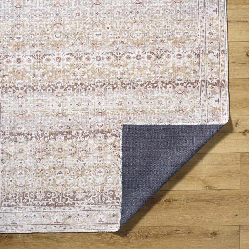 Close-up of Bienna Vintage Flat Pile Washable Rug showing camel, cream, brown, and peach traditional pattern and texture. Fold
