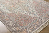 Close-up of the hand-loomed Bohdan Terracotta Area Rug showing its farmhouse style pattern and cotton texture. Corner