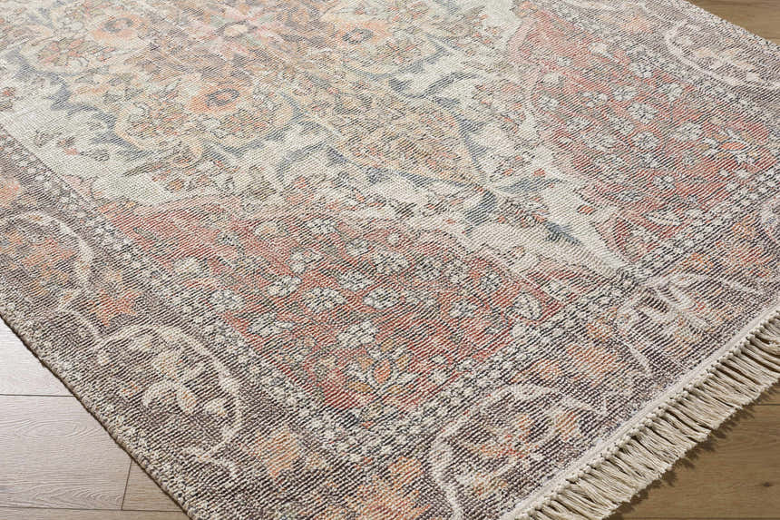 Close-up of the hand-loomed Bohdan Terracotta Area Rug showing its farmhouse style pattern and cotton texture. Corner