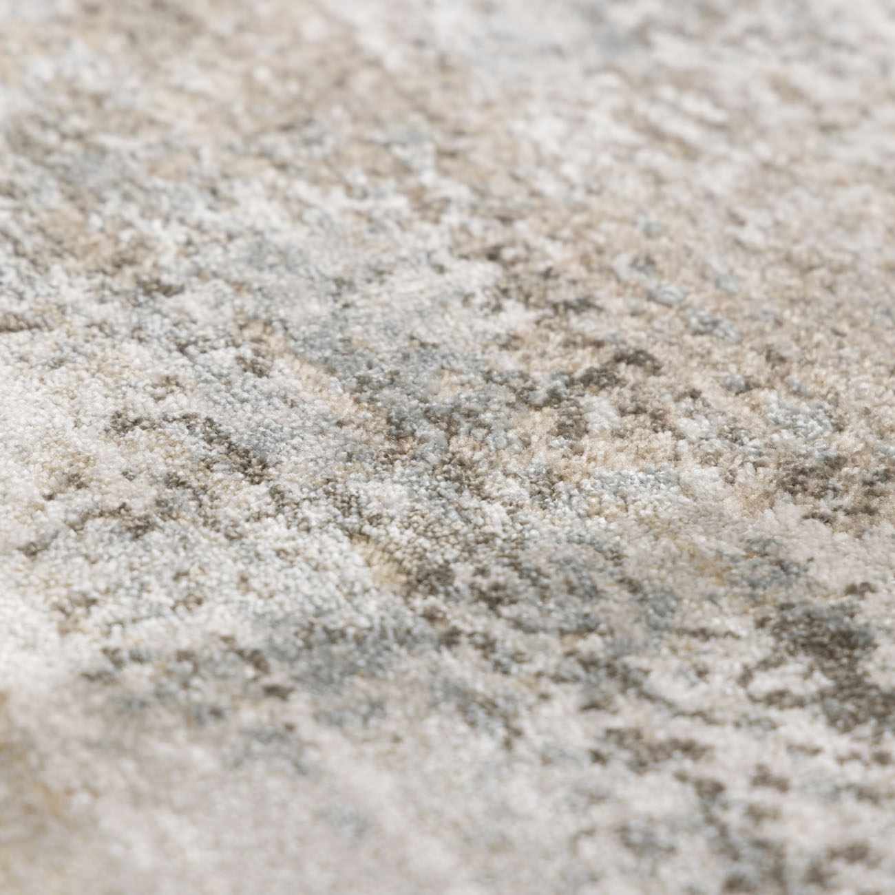 Close-up of the Bowdoinham Thick Luxe Boutique Rug, showing its textured weave and colors: taupe, light gray, and white. Texture
