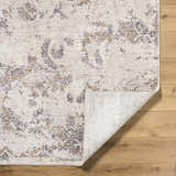 Close-up of the Breeda Charcoal Area Rug showing its cream, tan, and charcoal Southwestern pattern and soft texture. Fold