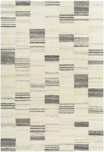 Close-up of the Blaton Area Rug. Hand-tufted wool rug in ash, desert sand, and pearl with a contemporary geometric pattern. Design-Rectangle-576