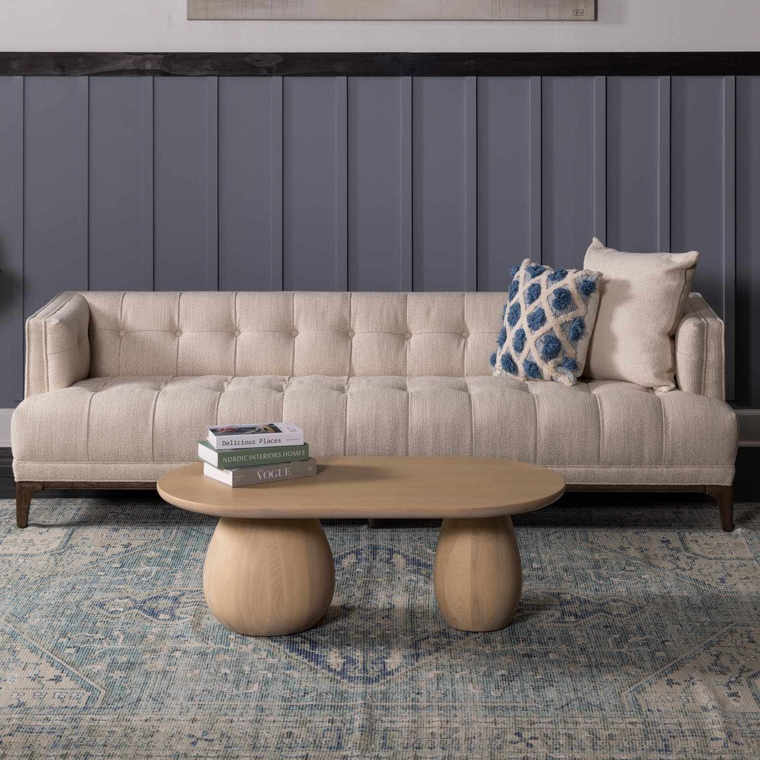 Living room scene with a Byers Handmade Cotton-blend Aqua Rug, beige sofa, and light wood coffee table. Roomscene-Rectangle
